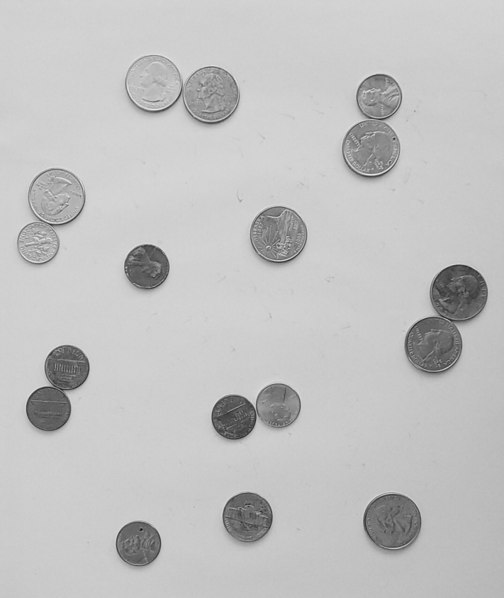 coins on a greyscale